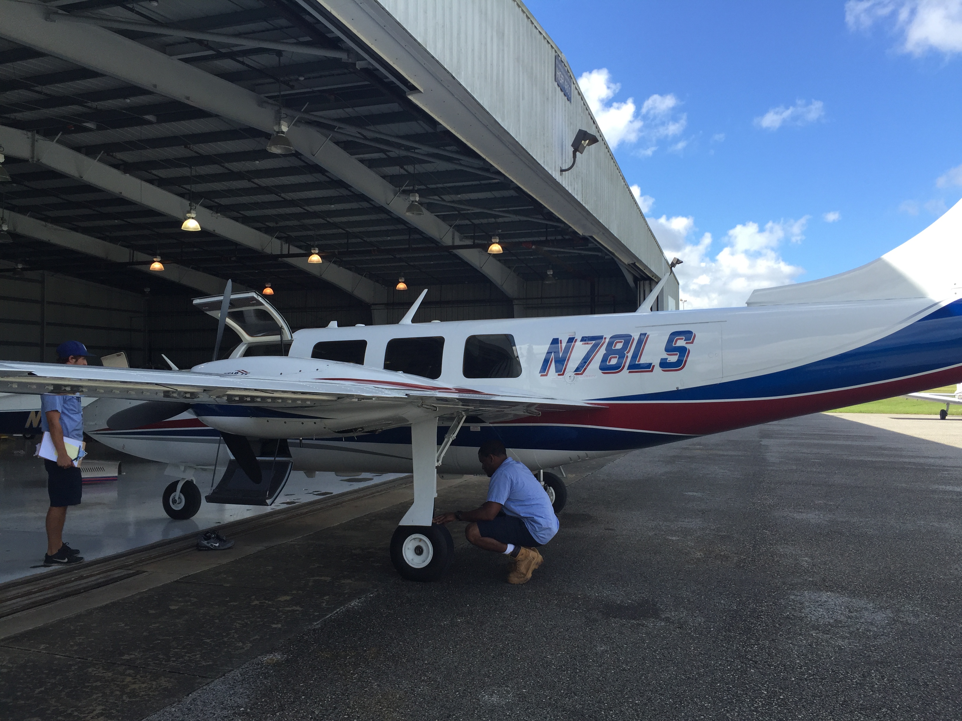 GAM mechanic inspecting aircraft
